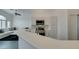 Kitchen with stainless steel appliances and view into living room at 8808 Tom Noon Ave # 101, Las Vegas, NV 89178