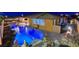 Night view of a luxury home with a pool and lights at 8970 Rancho Durango Ct, Las Vegas, NV 89148