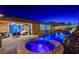 Night view of home exterior with pool and spa at 8970 Rancho Durango Ct, Las Vegas, NV 89148