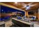 Night view of backyard patio with seating area and pool view at 8970 Rancho Durango Ct, Las Vegas, NV 89148