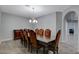 Elegant dining room featuring a large wood table and comfortable seating for eight at 8970 Rancho Durango Ct, Las Vegas, NV 89148