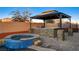 Relaxing hot tub with stonework and a gazebo at 8970 Rancho Durango Ct, Las Vegas, NV 89148