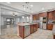 Modern kitchen with large island, stainless steel appliances and open floor plan at 8970 Rancho Durango Ct, Las Vegas, NV 89148