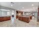 Spacious kitchen boasts granite countertops, custom cabinetry, and stainless steel appliances at 8970 Rancho Durango Ct, Las Vegas, NV 89148