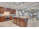 Open concept kitchen with island, stainless steel appliances, and custom cabinetry at 8970 Rancho Durango Ct, Las Vegas, NV 89148