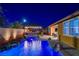 Night view of a luxurious pool and spa with lighting at 8970 Rancho Durango Ct, Las Vegas, NV 89148