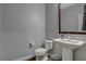 Well-appointed powder room with pedestal sink and mirror at 8970 Rancho Durango Ct, Las Vegas, NV 89148