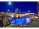 Night view of the pool, waterfall and spa at 8970 Rancho Durango Ct, Las Vegas, NV 89148