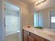 Bathroom with double vanity, mirror and bathtub at 8971 Dallas Ridge Ave, Las Vegas, NV 89178