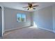 Bright bedroom with carpet, ceiling fan and window at 8971 Dallas Ridge Ave, Las Vegas, NV 89178