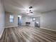 Spacious bonus room features wood-look floors and a ceiling fan at 8971 Dallas Ridge Ave, Las Vegas, NV 89178