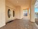 Brick paved porch with double doors leading into the home at 8971 Dallas Ridge Ave, Las Vegas, NV 89178