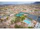 Community tennis courts, pool, bocce ball, and residential homes at 9520 Sundial Dr, Las Vegas, NV 89134