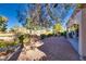 Backyard with gravel patio, covered patio, and golf course view at 9520 Sundial Dr, Las Vegas, NV 89134