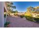 Backyard patio with covered seating area and golf course view at 9520 Sundial Dr, Las Vegas, NV 89134