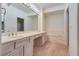 Elegant bathroom with double vanity, soaking tub, and marble accents at 9520 Sundial Dr, Las Vegas, NV 89134