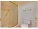 Clean bathroom with shower stall, toilet, and gold-toned fixtures at 9520 Sundial Dr, Las Vegas, NV 89134