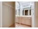 Bathroom with double vanity, mirrored medicine cabinet, and a large closet at 9520 Sundial Dr, Las Vegas, NV 89134