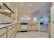 Bright kitchen features ample cabinetry and a view into the adjacent living area at 9520 Sundial Dr, Las Vegas, NV 89134