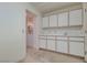 Simple kitchen with white cabinets and a sink at 9520 Sundial Dr, Las Vegas, NV 89134