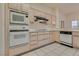 Kitchen with light wood cabinets, built-in microwave, and oven at 9520 Sundial Dr, Las Vegas, NV 89134