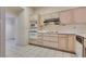 Kitchen with light wood cabinets and appliances at 9520 Sundial Dr, Las Vegas, NV 89134