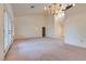 Large living room with high ceilings, chandelier, and French doors at 9520 Sundial Dr, Las Vegas, NV 89134