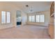 Living room with fireplace, built-ins, and large windows at 9520 Sundial Dr, Las Vegas, NV 89134