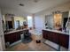 Large bathroom with double vanity and soaking tub at 9545 Belmont Bay Ave, Las Vegas, NV 89148