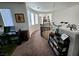 Upstairs hallway with curved staircase and office area at 9545 Belmont Bay Ave, Las Vegas, NV 89148