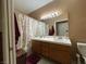 Clean bathroom with double vanity, shower/tub combo, and updated light fixtures at , Las Vegas, NV 89118