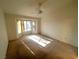 Main bedroom with bay window and ceiling fan at 10013 Cresent Creek Dr, Las Vegas, NV 89134