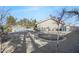 Large backyard with a pool, trampoline and mature landscaping at 10032 Fox Springs Dr, Las Vegas, NV 89117