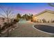 Charming backyard with a pool, trampoline, and mature landscaping at 10032 Fox Springs Dr, Las Vegas, NV 89117