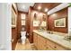 Elegant powder room with granite vanity and decorative wallpaper at 10032 Fox Springs Dr, Las Vegas, NV 89117