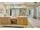 Spa-like Primary bathroom with double vanity, large soaking tub, and window at 10032 Fox Springs Dr, Las Vegas, NV 89117