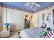 Cheerful bedroom with a playful, patriotic theme and built-in shelving at 10032 Fox Springs Dr, Las Vegas, NV 89117