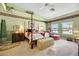 Luxurious Primary bedroom with a king bed, plush seating, and high ceilings at 10032 Fox Springs Dr, Las Vegas, NV 89117