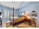 Charming bedroom with a wooden post bed, window shutters and a cozy atmosphere at 10032 Fox Springs Dr, Las Vegas, NV 89117