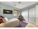 Bright bedroom with sliding door closet and neutral color scheme at 10032 Fox Springs Dr, Las Vegas, NV 89117
