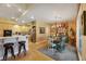 Charming dining area with floral wallpaper and a rustic farmhouse table at 10032 Fox Springs Dr, Las Vegas, NV 89117