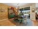 Rustic dining area with a view to the backyard through sliding doors at 10032 Fox Springs Dr, Las Vegas, NV 89117