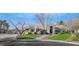 Single-story house with stone accents and landscaped yard at 10032 Fox Springs Dr, Las Vegas, NV 89117