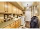 Laundry room with washer, dryer, cabinets, and utility sink at 10032 Fox Springs Dr, Las Vegas, NV 89117