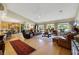 Spacious living room featuring hardwood floors and leather furniture at 10032 Fox Springs Dr, Las Vegas, NV 89117