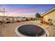 Large backyard with a trampoline, pool, and mountain views at 10032 Fox Springs Dr, Las Vegas, NV 89117