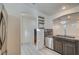 Modern kitchen with stainless steel appliances and dark wood cabinets at 10352 Mint Leaves St, Las Vegas, NV 89183