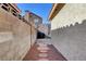 Stone pathway between block walls leading to a patio area at 1109 Sloop Dr, Las Vegas, NV 89128