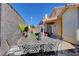 Relaxing backyard with patio furniture, grassy area, and covered patio at 1109 Sloop Dr, Las Vegas, NV 89128