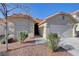 Single-story house with attached garage and desert landscaping at 1109 Sloop Dr, Las Vegas, NV 89128